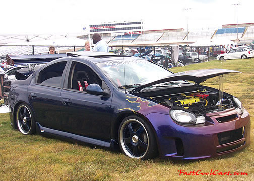 Lowriders that have been lowered, dropped, slammed, and scraping.