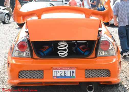 Lowriders that have been lowered, dropped, slammed, and scraping.