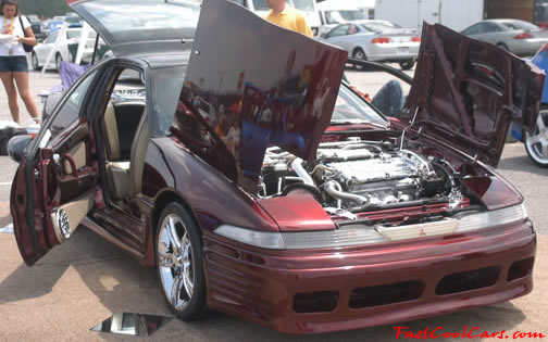 Lowriders that have been lowered, dropped, slammed, and scraping. Highly modified low rider.