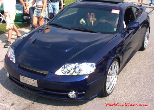 Lowriders that have been lowered, dropped, slammed, and scraping.