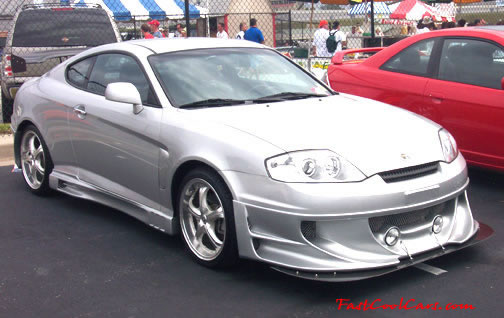 Lowriders that have been lowered, dropped, slammed, and scraping.