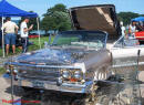 Lowriders that have been lowered, dropped, slammed, and scraping. American classic low rider car.