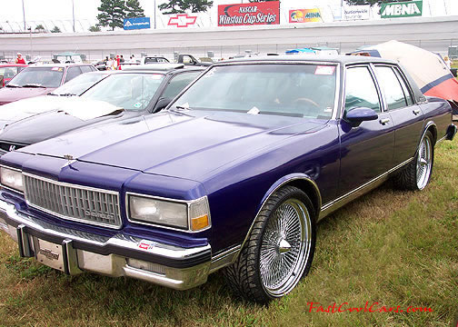 Lowriders that have been lowered, dropped, slammed, and scraping, using many different modifications. huge wheels.