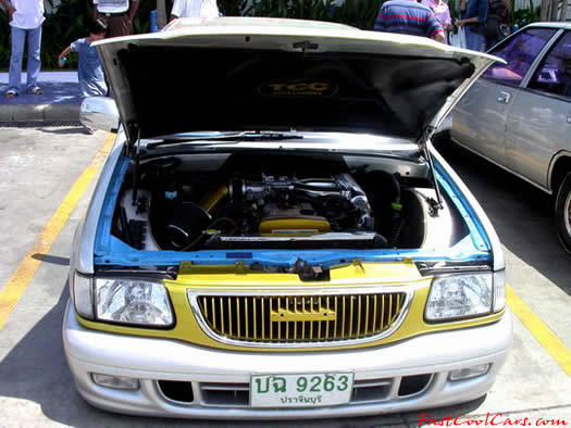 Lowrider pick-up that has been lowered, dropped, slammed, and scraping, using many different modifications.