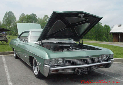 Lowriders that have been lowered, dropped, slammed, and scraping, using many different modifications. Vintage classic car.
