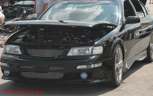 Lowriders that have been lowered, dropped, slammed, and scraping.