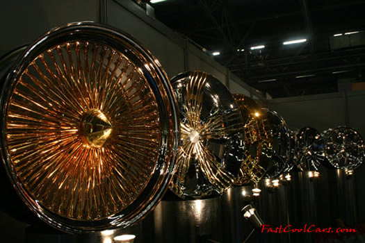 Lowriders that have been lowered, dropped, slammed, and scraping, Wire wheels.