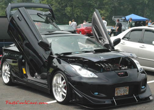 Lowriders that have been lowered, dropped, slammed, and scraping.