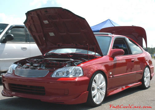Lowriders that have been lowered, dropped, slammed, and scraping.