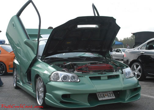 Lowriders that have been lowered, dropped, slammed, and scraping. Custom doors