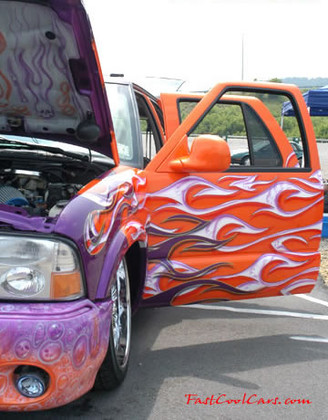 Lowriders that have been lowered, dropped, slammed, and scraping. SUV with cool custom graphics.