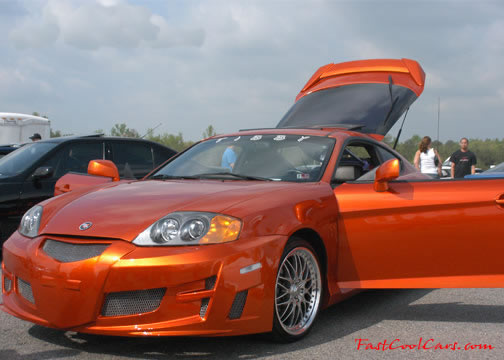 Lowriders that have been lowered, dropped, slammed, and scraping. Sweet color paint.