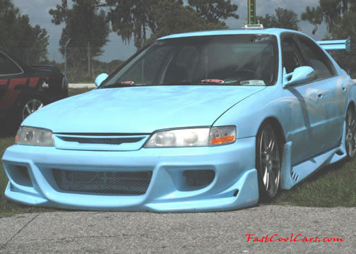 Lowriders that have been lowered, dropped, slammed, and scraping. on the ground.