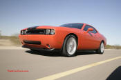 New Dodge Challenger, 6.1 V8 Hemi, 425 crank horsepower, 420 crank foot pounds of torque. SRT8, rolling down the highway.