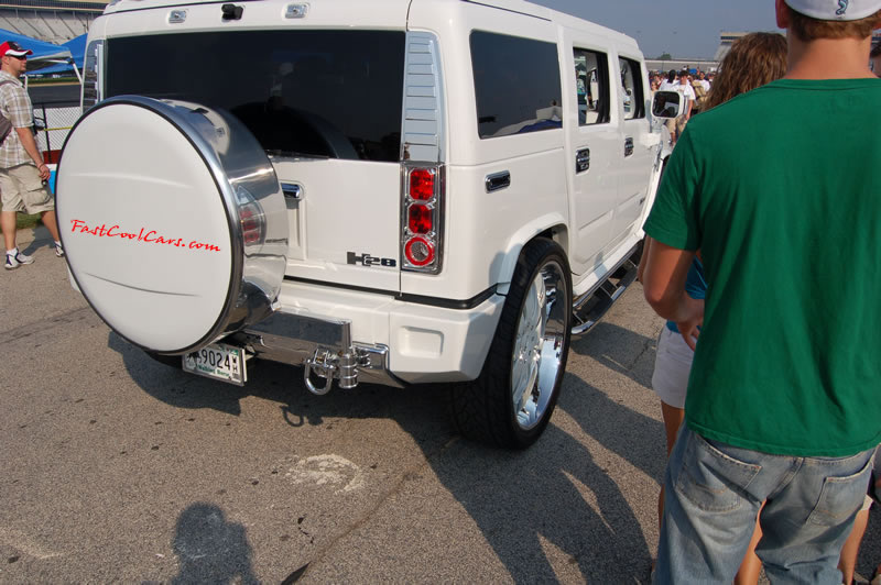 Pimped out ride, Pimp my ride with cool custom paint, and huge chrome and matching paint 28" rims. One nice Hummer.