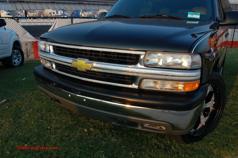 Pimped out ride, Pimp my ride with cool paint, and huge diamond encrusted rims, and diamond emblems all over this Chevy Suburban.