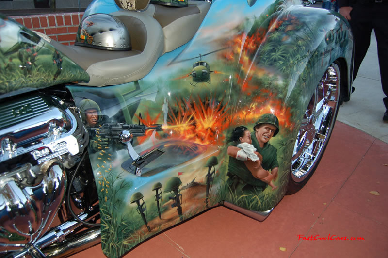 Pimped out ride, Pimp my ride with custom air brushed paint job, said to be about $25,000. for paint alone, with a 502 big block Chevrolet engine, one Pimped out trike, with huge chrome bling wheels, nice rims.
