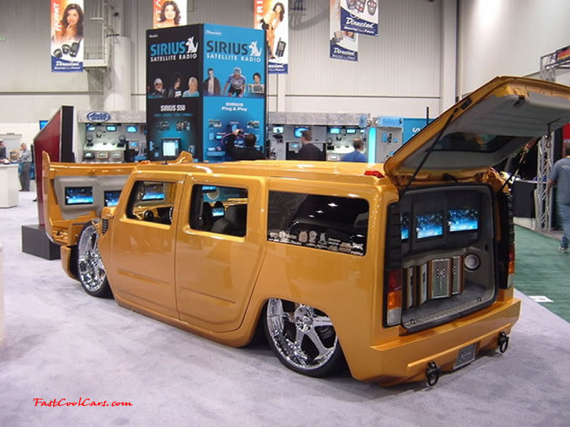 Pimped out ride, Pimp my ride with custom paint. Lots of chrome, huge wheels and one slammed Hummer, with lots of monitors.