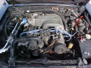 Front view of under the hood of 91' LX coupe 5.0 H.O. - chrome cold air intake with K&N filter, performance wires, underdrive pulley, daily driver