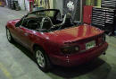 1990 Mazda Miata Roadster left rear angle view with the top down