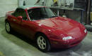 1990 Mazda Miata Roadster right front angle view with the top up