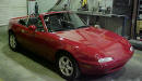1990 Mazda Miata Roadster right front view with the top down