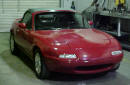 1990 Mazda Miata Roadster right front view with the top up
