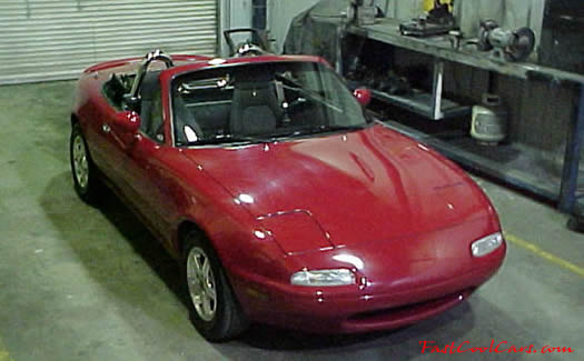 1990 Mazda Miata Roadster right front angle view with the top down