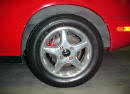 1990 Mazda Miata Roadster left front wheel view, with the polished aluminum wheels, and Michelin tires