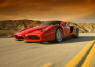 Ferrari Enzo flying down a desert highway