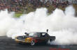 Classic Ford Mustang doing a huge burnout, blown Mustang too.