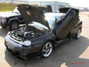 Nopi Nationals - Motorsports Supershow 2005, gull winged doors on a cool black ride.