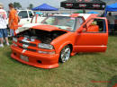Nopi Nationals - Motorsports Supershow 2005, Nice low rider pick-up with cool orange paint and white racing stripes.