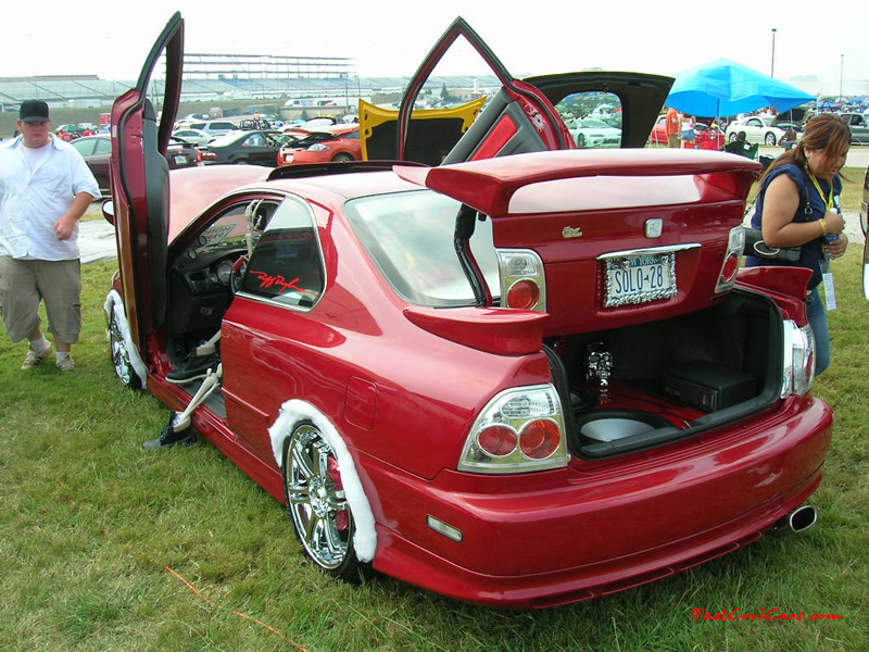 Nopi Nationals - Motorsports Supershow 2005, custumized and gull winged doors, big chrome wheels, and chrome tail lights.