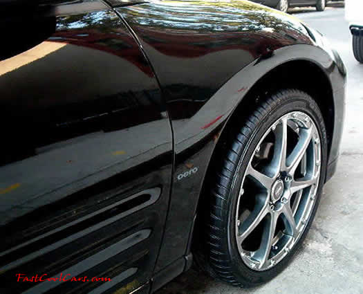 2003 Black Mitsubishi Eclipse Spyder convertible, with killer wheels, customized.