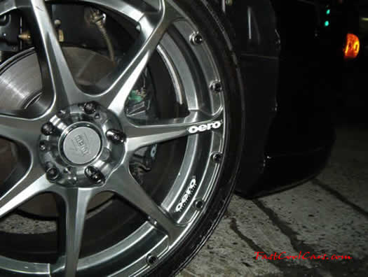 2003 Black Mitsubishi Eclipse Spyder convertible, with killer wheels, customized.