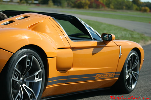 The 2005 Ford GTX1 - Gleaming orange paint with tungsten racing stripes. A removable hard-top aluminum roof. Custom designed forged modular wheels. And a 618-700 horsepower, 5.4L supercharged V-8 engine. 