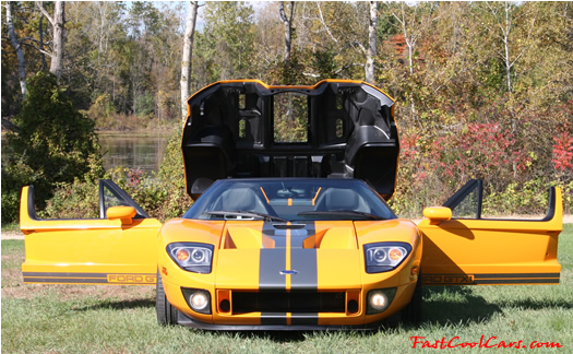 The 2005 Ford GTX1 - Gleaming orange paint with tungsten racing stripes. A removable hard-top aluminum roof. Custom designed forged modular wheels. And a 618-700 horsepower, 5.4L supercharged V-8 engine. 