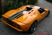 The 2005 Ford GTX1 - Gleaming orange paint with tungsten racing stripes. A removable hard-top aluminum roof. Custom designed forged modular wheels. And a 618-700 horsepower, 5.4L supercharged V-8 engine. 