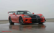 2009 Dodge Viper ACR - You're looking at Dodge's answer to the Porsche 911 GT3 RS or Lotus Exige, a road car you can drive to the track, hot lap all day, and drive back home, tires, brakes, and ego intact. The Viper ACR is raw. It's wired. And it's probably the best weekend racer yet from Detroit.