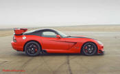 2009 Dodge Viper ACR - You're looking at Dodge's answer to the Porsche 911 GT3 RS or Lotus Exige, a road car you can drive to the track, hot lap all day, and drive back home, tires, brakes, and ego intact. The Viper ACR is raw. It's wired. And it's probably the best weekend racer yet from Detroit.