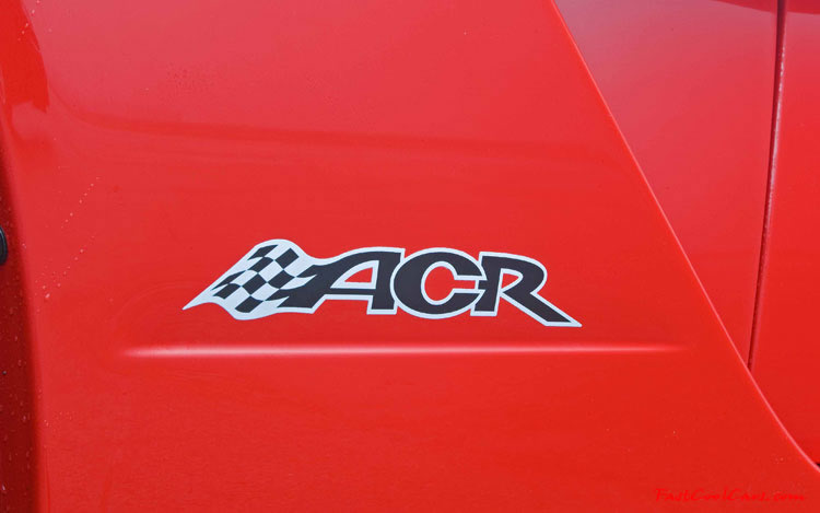 2009 Dodge Viper ACR - You're looking at Dodge's answer to the Porsche 911 GT3 RS or Lotus Exige, a road car you can drive to the track, hot lap all day, and drive back home, tires, brakes, and ego intact. The Viper ACR is raw. It's wired. And it's probably the best weekend racer yet from Detroit.