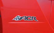 2009 Dodge Viper ACR - You're looking at Dodge's answer to the Porsche 911 GT3 RS or Lotus Exige, a road car you can drive to the track, hot lap all day, and drive back home, tires, brakes, and ego intact. The Viper ACR is raw. It's wired. And it's probably the best weekend racer yet from Detroit.
