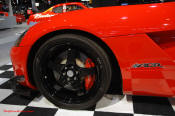 2009 Dodge Viper ACR - You're looking at Dodge's answer to the Porsche 911 GT3 RS or Lotus Exige, a road car you can drive to the track, hot lap all day, and drive back home, tires, brakes, and ego intact. The Viper ACR is raw. It's wired. And it's probably the best weekend racer yet from Detroit.
