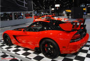 2009 Dodge Viper ACR - You're looking at Dodge's answer to the Porsche 911 GT3 RS or Lotus Exige, a road car you can drive to the track, hot lap all day, and drive back home, tires, brakes, and ego intact. The Viper ACR is raw. It's wired. And it's probably the best weekend racer yet from Detroit.