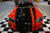 2009 Dodge Viper ACR - You're looking at Dodge's answer to the Porsche 911 GT3 RS or Lotus Exige, a road car you can drive to the track, hot lap all day, and drive back home, tires, brakes, and ego intact. The Viper ACR is raw. It's wired. And it's probably the best weekend racer yet from Detroit.
