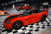 2009 Dodge Viper ACR - You're looking at Dodge's answer to the Porsche 911 GT3 RS or Lotus Exige, a road car you can drive to the track, hot lap all day, and drive back home, tires, brakes, and ego intact. The Viper ACR is raw. It's wired. And it's probably the best weekend racer yet from Detroit.