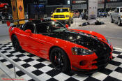 2009 Dodge Viper ACR - You're looking at Dodge's answer to the Porsche 911 GT3 RS or Lotus Exige, a road car you can drive to the track, hot lap all day, and drive back home, tires, brakes, and ego intact. The Viper ACR is raw. It's wired. And it's probably the best weekend racer yet from Detroit.