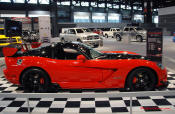 2009 Dodge Viper ACR - You're looking at Dodge's answer to the Porsche 911 GT3 RS or Lotus Exige, a road car you can drive to the track, hot lap all day, and drive back home, tires, brakes, and ego intact. The Viper ACR is raw. It's wired. And it's probably the best weekend racer yet from Detroit.