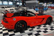 2009 Dodge Viper ACR - You're looking at Dodge's answer to the Porsche 911 GT3 RS or Lotus Exige, a road car you can drive to the track, hot lap all day, and drive back home, tires, brakes, and ego intact. The Viper ACR is raw. It's wired. And it's probably the best weekend racer yet from Detroit.
